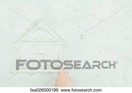 Hand drawing house in sand, cropped view View Large Photo Image Stock Photo - Hand drawing house in sand, cropped view. Fotosearch