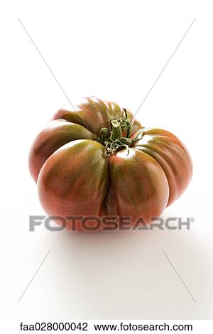 Heirloom tomato, close-up View Large Photo Image Stock Image - Heirloom tomato, close-up. Fotosearch