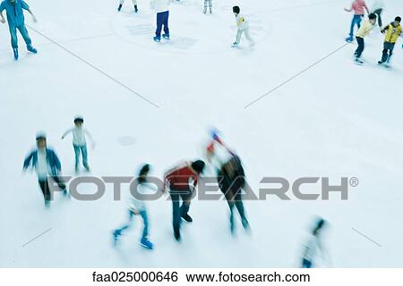 Ice skaters, high angle view View Large Photo Image Stock Photograph - Ice skaters, high angle view. Fotosearch
