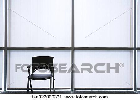 Stock Image - Interior with empty chair. Fotosearch