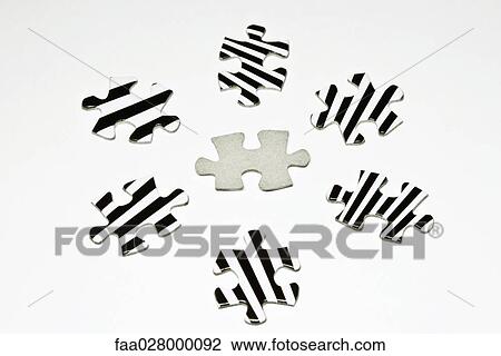 Stock Image - Jigsaw puzzle pieces, close-up. Fotosearch