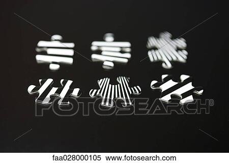 Stock Photography - Jigsaw puzzle pieces, close-up. Fotosearch