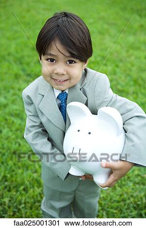 Little boy dressed in full suit holding piggy bank View Large Photo Image Stock Image - Little boy dressed in full suit holding piggy bank. Fotosearch