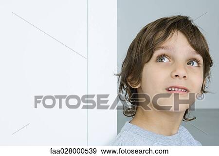 Little boy looking up, head and shoulders View Large Photo Image Stock Photo - Little boy looking up, head and shoulders. Fotosearch