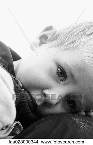 Little boy resting head on arms, portrait, cropped View Large Photo Image Picture - Little boy resting head on arms, portrait, cropped. Fotosearch