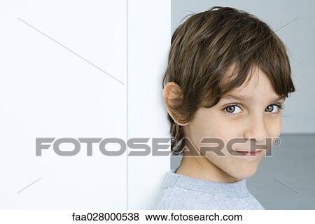 Little boy, smiling at camera, portrait View Large Photo Image Stock Photo - Little boy, smiling at camera, portrait. Fotosearch