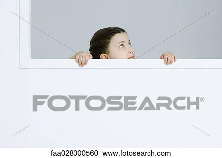 Little girl holding onto windowsill, looking up View Large Photo Image Stock Image - Little girl holding onto windowsill, looking up. Fotosearch