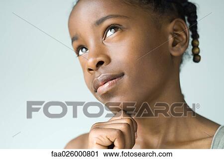 Little girl looking up, hand under chin, close-up View Large Photo Image Stock Image - Little girl looking up, hand under chin, close-up. Fotosearch