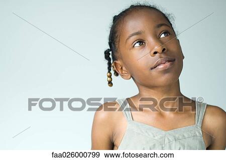 Little girl looking up, head and shoulders, portrait View Large Photo Image Stock Photo - Little girl looking up, head and shoulders, portrait. Fotosearch