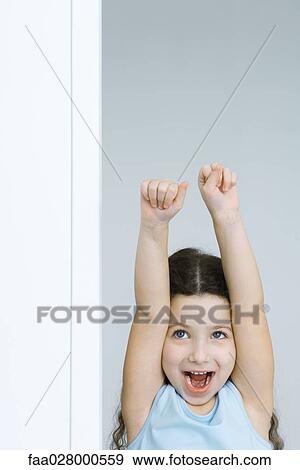 Little girl shouting and raising arms, front view View Large Photo Image Stock Photo - Little girl shouting and raising arms, front view. Fotosearch