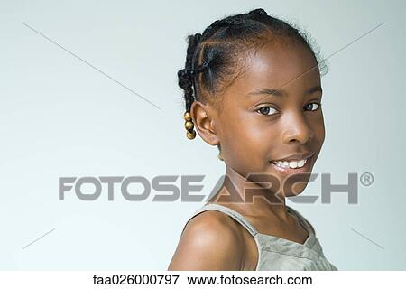 Little girl, smiling at camera, head and shoulders, portrait View Large Photo Image Stock Photo - Little girl, smiling at camera, head and shoulders, portrait. Fotosearch