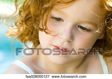 Little girl with red hair looking down, portrait View Large Photo Image Stock Photo - Little girl with red hair looking down, portrait. Fotosearch