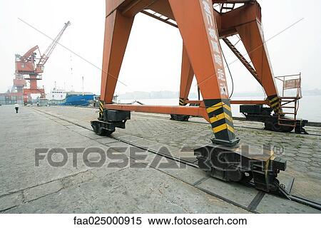 Loading crane on rails in shipyard View Large Photo Image Stock Photography - Loading crane on rails in shipyard. Fotosearch