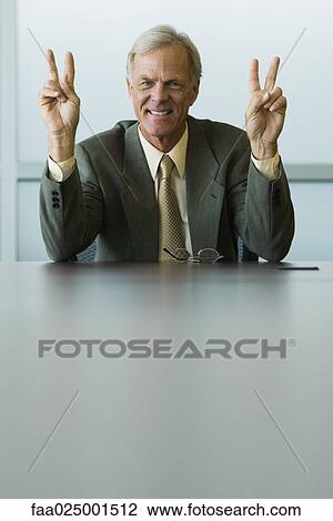 looking at camera, gesture, smiling, leaning on elbow, businessman, toothy smile View Large Photo Image Stock Image - looking at camera, gesture, smiling, leaning on elbow, businessman, toothy smile. Fotosearch