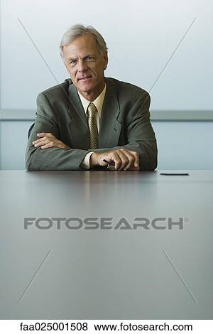 looking at camera, glasses, arms folded, businessman, holding, ceo View Large Photo Image Stock Photo - looking at camera, glasses, arms folded, businessman, holding, ceo. Fotosearch