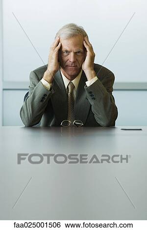 looking at camera, leaning on elbow, headache, businessman, holding head, ceo View Large Photo Image Stock Photograph - looking at camera, leaning on elbow, headache, businessman, holding head, ceo. Fotosearch