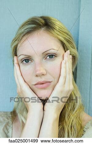looking at camera, portrait, woman, holding head, hand under chin, young women View Large Photo Image Stock Photo - looking at camera, portrait, woman, holding head, hand under chin, young women. Fotosearch
