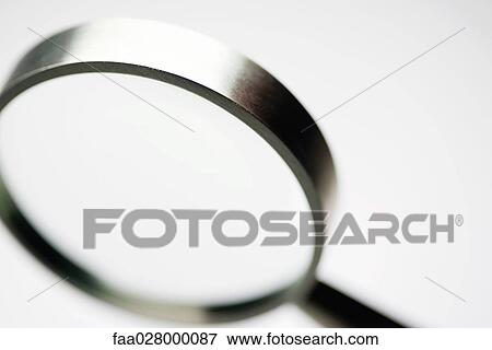 Magnifying glass, close-up, cropped View Large Photo Image Stock Photo - Magnifying glass, close-up, cropped. Fotosearch