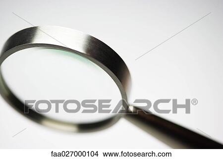 Picture - Magnifying glass, close-up. Fotosearch