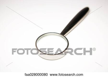 Stock Image - Magnifying glass, close-up. Fotosearch
