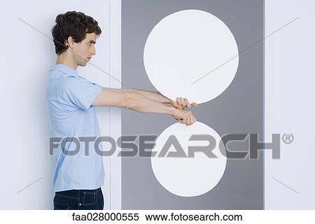 Man holding out two blank signs View Large Photo Image Stock Photography - Man holding out two blank signs. Fotosearch