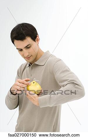 Man holding pear tied with ribbon, looking down View Large Photo Image Stock Image - Man holding pear tied with ribbon, looking down. Fotosearch