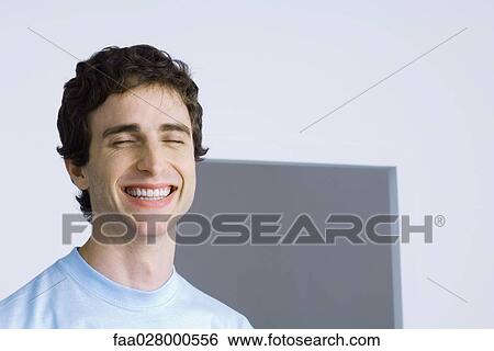 Man laughing with eyes closed View Large Photo Image Stock Photograph - Man laughing with eyes closed. Fotosearch