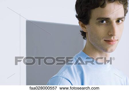 Man looking at camera, head and shoulders, portrait View Large Photo Image Stock Photo - Man looking at camera, head and shoulders, portrait. Fotosearch