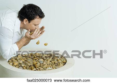 Man splashing face with rocks View Large Photo Image Stock Image - Man splashing face with rocks. Fotosearch