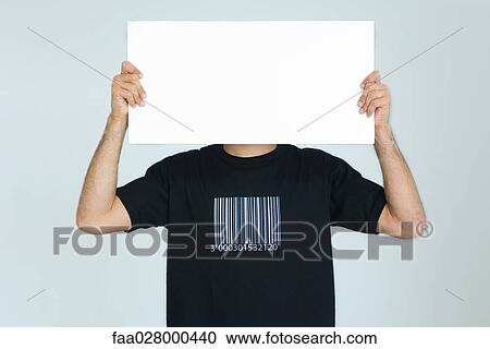 Man wearing tee-shirt with bar code, holding blank sign in front of face View Large Photo Image Stock Image - Man wearing tee-shirt with bar code, holding blank sign in front of face. Fotosearch