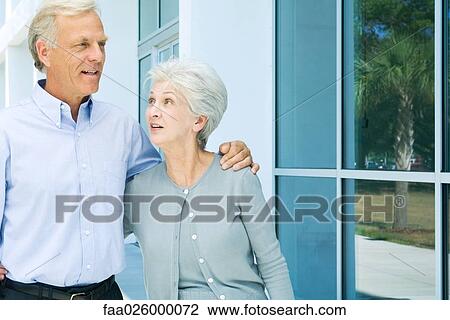 Mature couple walking together, both smiling, close-up View Large Photo Image Stock Image - Mature couple walking together, both smiling, close-up. Fotosearch