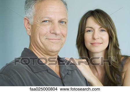 Mature father and adult daughter smiling at camera, portrait View Large Photo Image Picture - Mature father and adult daughter smiling at camera, portrait. Fotosearch