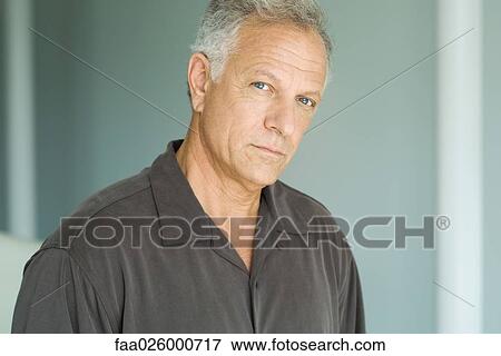 Stock Photo - Mature man, looking at camera, portrait. Fotosearch