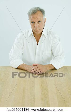 Mature man looking at camera, portrait View Large Photo Image Stock Photograph - Mature man looking at camera, portrait. Fotosearch