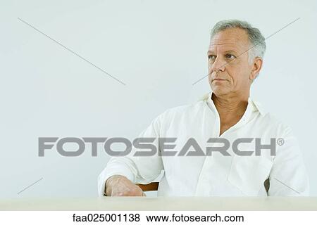 Stock Photo - Mature man looking away, portrait. Fotosearch