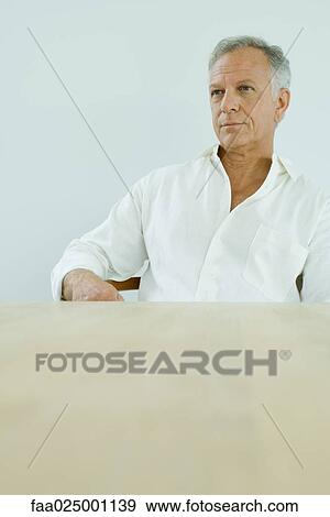 Mature man looking away, portrait View Large Photo Image Stock Photo - Mature man looking away, portrait. Fotosearch