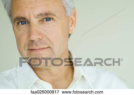 Mature man smiling at camera, close-up, portrait View Large Photo Image Stock Photo - Mature man smiling at camera, close-up, portrait. Fotosearch