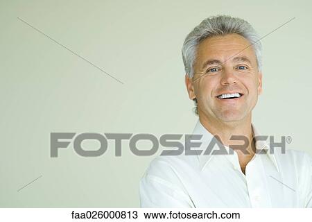 Mature man smiling, head and shoulders, portrait View Large Photo Image Stock Image - Mature man smiling, head and shoulders, portrait. Fotosearch
