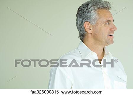 Mature man smiling, looking away, head and shoulders, portrait View Large Photo Image Stock Photography - Mature man smiling, looking away, head and shoulders, portrait. Fotosearch
