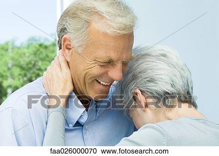 Mature woman leaning her head on husband's chest, close-up View Large Photo Image Stock Image - Mature woman leaning her head on husband's chest, close-up. Fotosearch