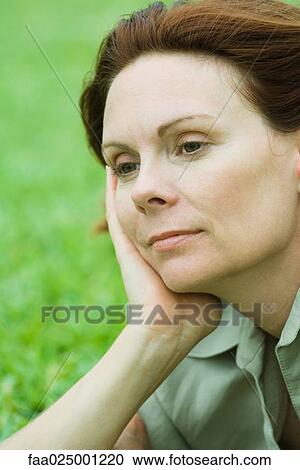Mature woman leaning on hand, looking away, portrait View Large Photo Image Stock Image - Mature woman leaning on hand, looking away, portrait. Fotosearch