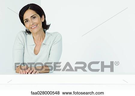 Mature woman, smiling at camera, portrait View Large Photo Image Stock Photo - Mature woman, smiling at camera, portrait . Fotosearch