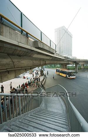 Metal staircase leading to street market under overpass View Large Photo Image Stock Image - Metal staircase leading to street market under overpass. Fotosearch