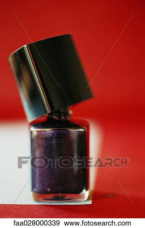 Nail polish bottle, opened, close-up View Large Photo Image Stock Photo - Nail polish bottle, opened, close-up. Fotosearch