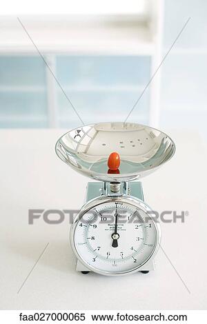 One cherry tomato on scale, close-up View Large Photo Image Stock Photography - One cherry tomato on scale, close-up. Fotosearch