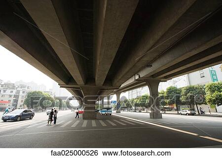 Pedestrian crossing under overpass, low angle view View Large Photo Image Stock Photograph - Pedestrian crossing under overpass, low angle view. Fotosearch