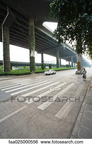 Stock Photograph - Pedestrian crossing under overpass. Fotosearch