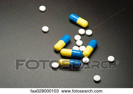 Pills and capsules, close-up View Large Photo Image Stock Image - Pills and capsules, close-up. Fotosearch
