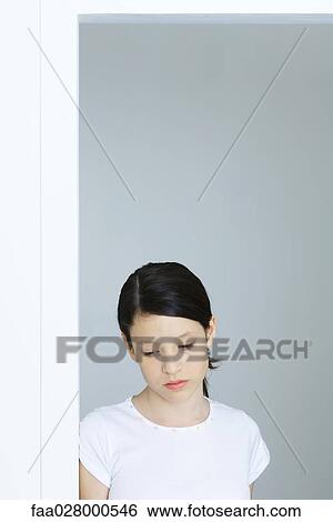 Preteen girl looking down, portrait View Large Photo Image Stock Photograph - Preteen girl looking down, portrait. Fotosearch