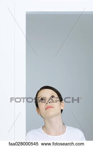 Preteen girl looking up View Large Photo Image Stock Photography - Preteen girl looking up. Fotosearch